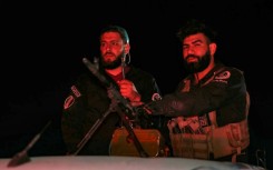 Syrian security forces at a checkpoint in Jaramana near Damascus early on May 2