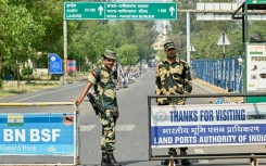 Indian Border Security Force personnel stand guard near the India-Pakistan Wagah border post