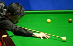 China's Zhao Xintong plays a shot at the World Snooker Championship in 2022