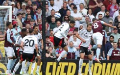 Aston Villa's Youri Tielemans (R) heads the winner against Fulham