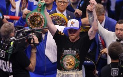 Mexico's Canelo Alvarez celebrates after wunifying the super middleweight titles against Cuba's William Scull