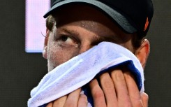 Jannik Sinner washes his face during an open training ahead of his return to action at the Rome Open