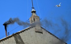 Black smoke rose from the chimney of the Sistine Chapel signalling that cardinals failed to elect a new pope