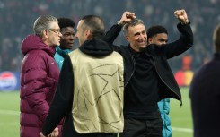 PSG coach Luis Enrique (R) celebrates his team's victory over Arsenal in Wednesday's Champions League semi-final