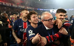 PSG players, including Joao Neves (C), and sporting director Luis Campos celebrate at the Parc des Princes after reaching the Champions League final