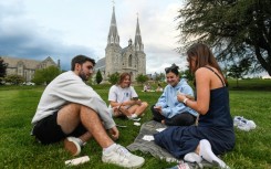 Students play cards outside of St. Thomas of Villanova Church at the campus of Villanova University in Villanova, Pennsylvania, where Pope Leo XIV studied and graduated in 1977