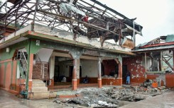 Worshippers held Friday prayers at a mosque in Pakistan-administered Kashmir that was damaged by Indian air strikes