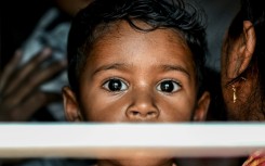A boy looking out of the train