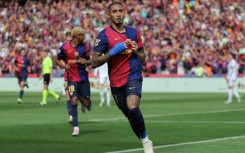 Barcelona's Brazilian forward Raphinha celebrates scoring their fourth goal against Real Madrid