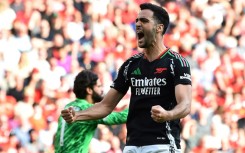 Arsenal midfielder Mikel Merino celebrates after scoring at Liverpool