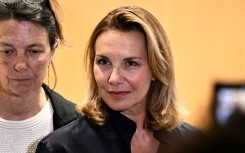 One of the plaintiffs, Amelie, speaks to the press after a Paris court convicted French cinema icon Gerard Depardieu of sexually assaulting her and another woman