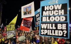 Supporters of the remaining Israeli hostages in Gaza demonstrate outside the US embassy branch in Tel Aviv to urge US intervention to secure their negotiated release.