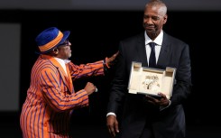 US actor Denzel Washington receives the award from US director Spike Lee
