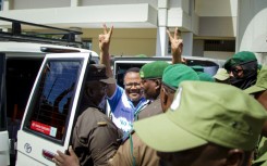 Mwangi had travelled to Dar es Salaam to show solidarity with arrested opposition leader Tundu Lissu (centre)