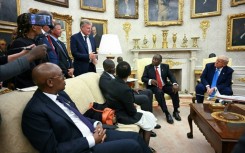 South African golfer Ernie Els, standing, speaks during the Oval Office meeting between US President Donald Trump and South African President Cyril Ramaphosa