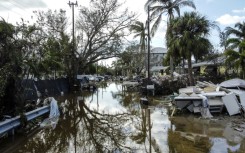 A flooded street with debris in the aftermath of Hurricane Milton, in Siesta Key, Florida, on October 10, 2024