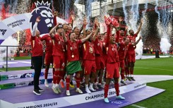 Liverpool's Virgil van Dijk lifts the Premier League trophy