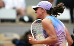 Poland's Iga Swiatek celebrates her first-round victory over Slovakia’s Rebecca Sramkova