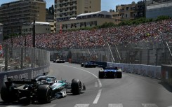 Traffic jam: Mercedes driver George Russell (L) grew frustrated when he was stuck behind the the slow-moving Williams cars on Sunday