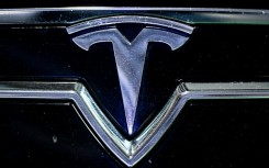 The logo of US company Tesla displayed at the Paris Motor Show at Paris Expo Porte de Versailles in Paris on October 16, 2024