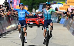 Christian Scaroni (R) crossed the finish line with Astana teammate Lorenzo Fortunato but claimed victory in stage 16 of the Giro d'Italia