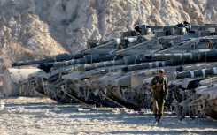 Israeli tanks take position on the Gaza border amid calls from a far-right minister to use "full force" in the battered territory.