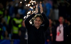 Antonio Conte will stay on as Napoli coach after winning the Serie A title