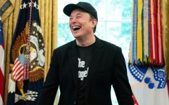 Elon Musk laughs during a news conference with US President Donald Trump in the Oval Office of the White House in Washington, DC, on May 30, 2025
