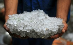 Hailstones covered the ground and battered seafront businesses during the storm in Egypt's Alexandria