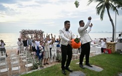 Song and Wang were surrounded by dozens of close friends and their ring-bearing small fluffy dog on their wedding day