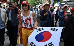 Supporters of South Korean presidential candidate Kim Moon-soo of the People Power Party attend a campaign event ahead of the presidential election