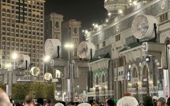 Big fans blow air as Muslim worshippers gather at the Grand Mosque in Mecca