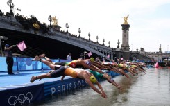 Athletes dive into the Seine during the Paris 2024 Olympic Games