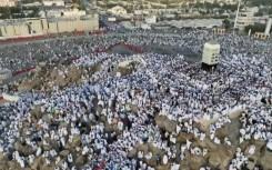 AERIAL SHOTS of Muslim pilgrims praying on Mount Arafat in hajj climax