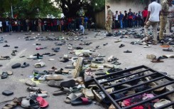 Abandoned shoes and a fallen barrier outside the Chinnaswamy Stadium in Bengaluru after a crush killed 11 people celebrating their team's IPL victory