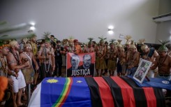 Xukuru's Indigenous people sing a sacred prayer in honor of the Brazilian Indigenous expert Bruno Pereira next to his coffin during his funeral after his murder in June 2022
