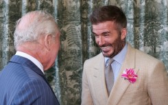 Britain's King Charles III speaks with former England captain David Beckham at the Chelsea Flower Show in London in May 2025