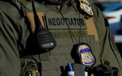 This file photo shows an Immigration and Customs Enforcement (ICE) agent standing near a newly converted immigrant detention centre in New Jersey in May