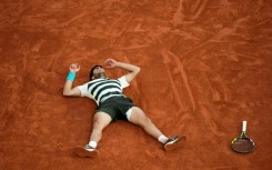 Carlos Alcaraz celebrates after an incredible French Open win over Jannik Sinner in five sets
