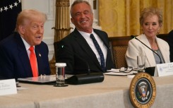 US President Donald Trump speaks as US Secretary of Health and Human Services Robert F. Kennedy Jr. (C), and US Secretary of Education Linda McMahon look on during a MAHA (Make America Healthy Again) Commission Event