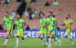 Australia's players celebrate reaching the World Cup