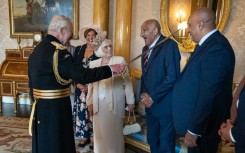 Former Rugby League player Billy Boston is knighted by Britain's King Charles III