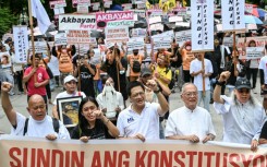 People protest following the Senate's decision on the impeachment trial of Philippine Vice President Sara Duterte