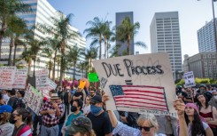 Over 1,000 people massed in America's second biggest city for a sixth day of protests, with the crowd peaceful as they marched through the streets