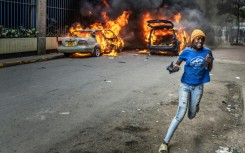 Protesters marched on parliament on Thursday, some throwing stones and police firing tear gas