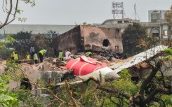 There was one survivor out of 242 passengers and crew on board the jet when it crashed, leaving the tailpiece of the aircraft jutting out of a hostel for medical staff