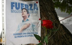 A poster is displayed during a mass for the health of Colombian senator Miguel Uribe, who was shot in Bogota in early June