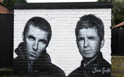 A mural by the artist known as Snow Graffiti of Liam and Noel Gallagher outside the Whitefield pub in Manchester, where they will play in July