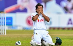 Bangladesh's captain Najmul Hossain Shanto celebrates after scoring a century during the fifth and final day of the first Test cricket match against Sri Lanka