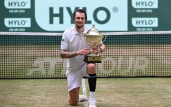 Kazakhstan's Alexander Bublik celebrates his second title on the grass of Halle, Germany
